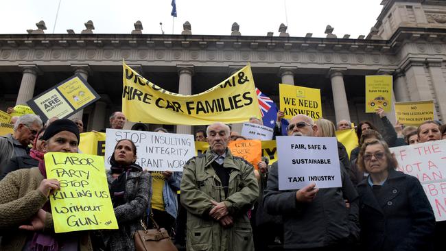Taxi drivers protest on the steps of Parliament House, Melbourne. Picture: Tracey Nearmy/AAP.