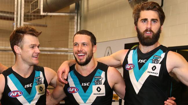 Port Adelaide’s Robbie Gray, Travis Boak and Justin Westhoff.