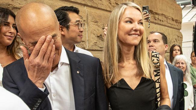 Dr Charlie Teo wipes away a tear as he arrives at the Health Care Complaints Commission Professional Standards Committee Inquiry on Monday morning with his fiancee Traci Griffiths.