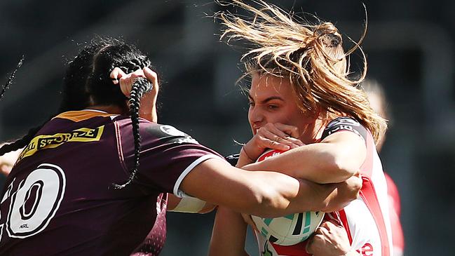 Hair-raising! Jessica Sergis attempting to avoid the Broncos defence in round one.