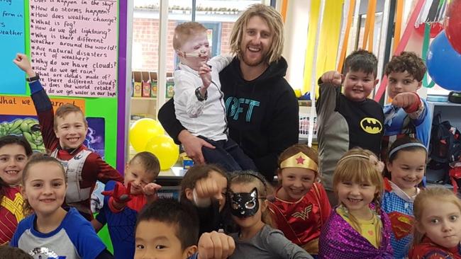 Dyson Heppell surprised Harrison Pennicott and his Warranwood Primary School classmates recently. Picture: Supplied