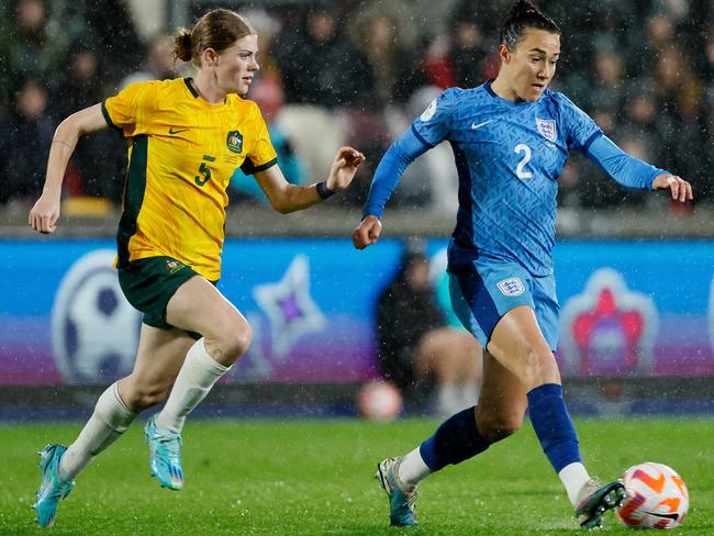 Cortnee Vine chases down England star Lucy Bronze in their clash earlier this year, won by the Matildas. The old enemy awaits in the World Cup semi-finals. Picture: Richard Sellers/Soccrates/Getty Images