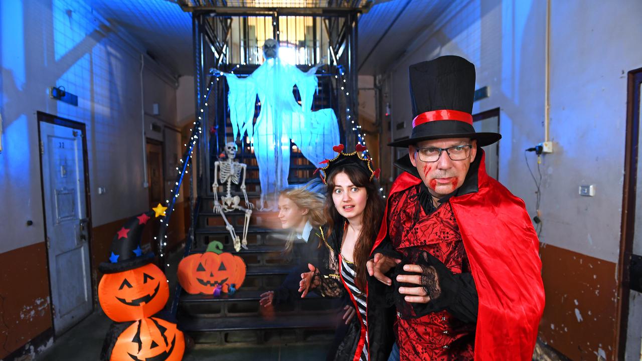 Elsa Symes and Gary Joyce get an early scare by ghost Elly Brake at the Adelaide Gaol, October 2022. Picture: Mark Brake