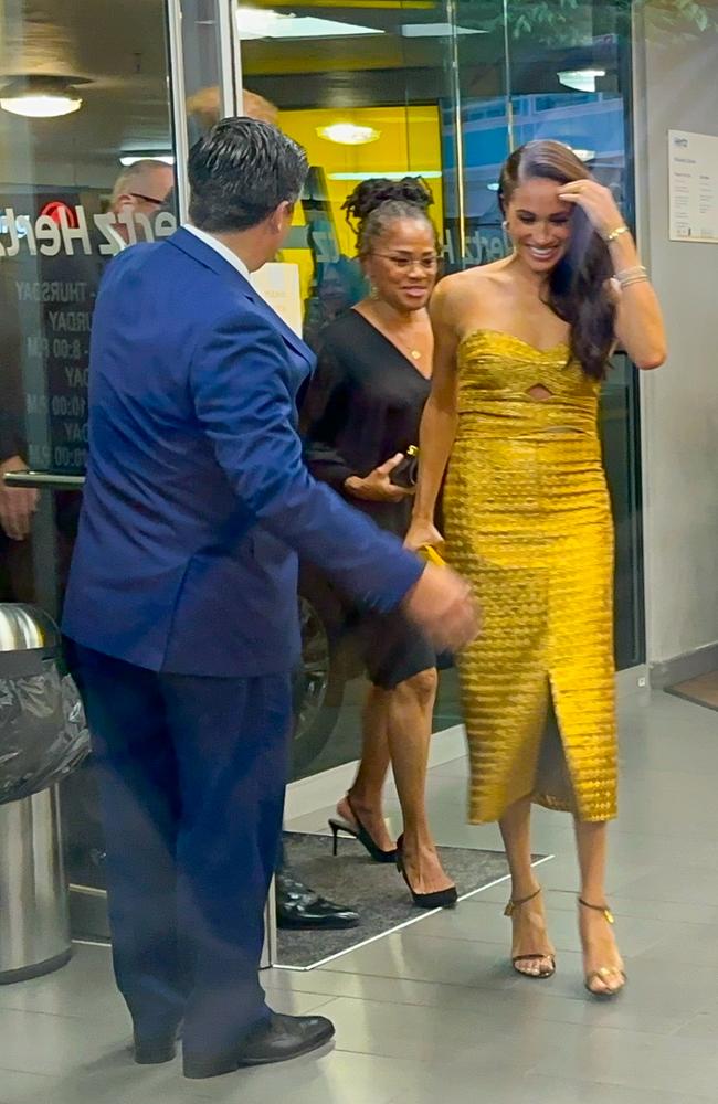 Meghan Markle appeared unfazed by a heckler as she arrived in the lobby with Prince Harry and her mother Doria Ragland. Picture: Raymond Hall/GC Images