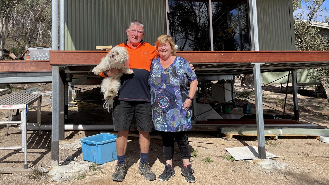 Glen Lough Cabins owners Sheila and Pat O'Boyle and their dog Patch. Photo: Madison Mifsud-Ure / Stanthorpe Border Post