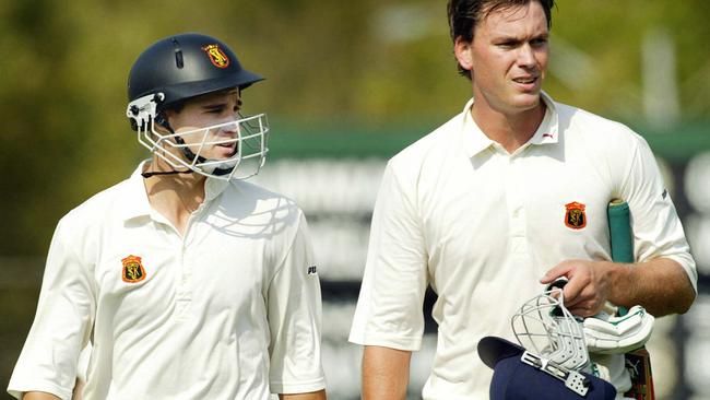 Graeme Rummans and Nick Jewell walk off at the tea break in the 2002-03 Premier Cricket grand final, St Kilda v Frankston Peninsula, at the Albert Ground.