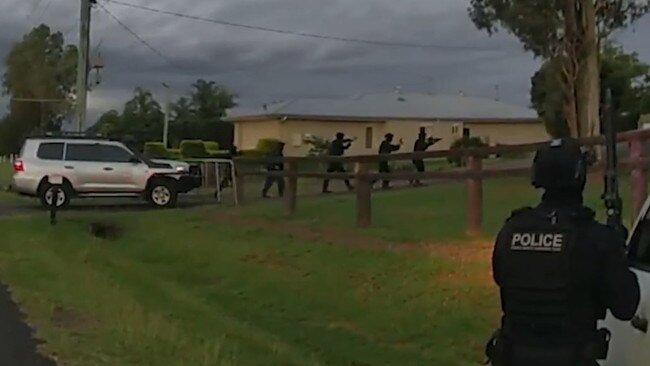 Police conduct a raid during Operation Whiskey Legion’s deployment in Ipswich and Logan.