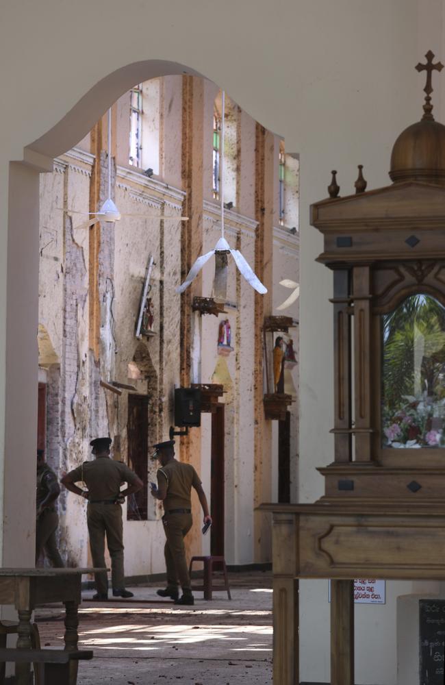 Sri Lankan policemen keep vigil at St. Sebastian's Church, where a suicide bomber blew himself up on Easter Sunday. Picture: AP