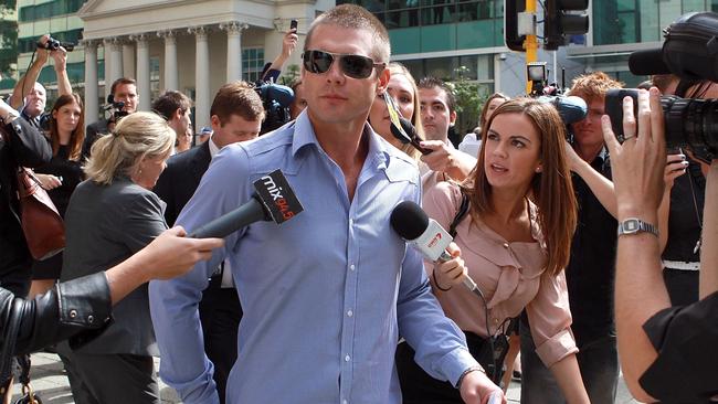 Ben Cousins is mobbed by media.