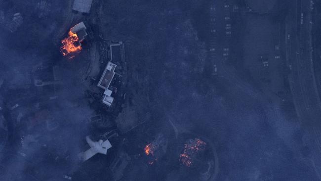 Aerial image of Catalonia Ave Pacific Palisades with smouldering fires still burning. Picture: Nearmap