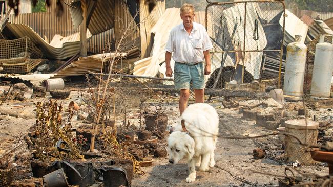 Rex Newton says he returned to his home’s ruins to find his dogs had been taken and an aviary of 50 pigeons released. Picture: Mark Stewart