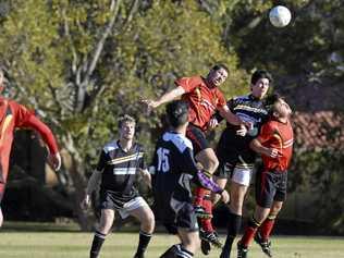 TIGHT TUSSLE: Gatton's Austin Lenord (left) and Oliver Wacker (right) contest the ball with West Wanderers player Mitchell Albury. Gatton won the Premier Men's match 3-1. Picture: Kevin Farmer