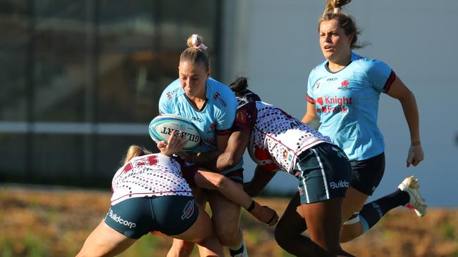 Layne Morgan in the thick of the action in the match against the Queensland Reds at Concord Oval.