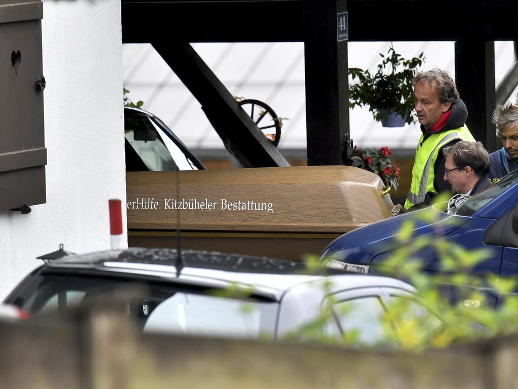 A coffin is carried out of a house in Kitzbühel, Austria, where Andreas slaughtered five including hockey star Florian Janny. Picture: Kerstin Joensson