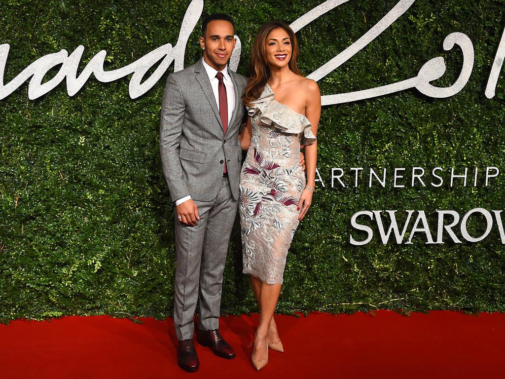 Racing driver Lewis Hamilton and singer Nicole Scherzinger pose for photographers upon arrival at The British Fashion Awards 2014. Picture: AP