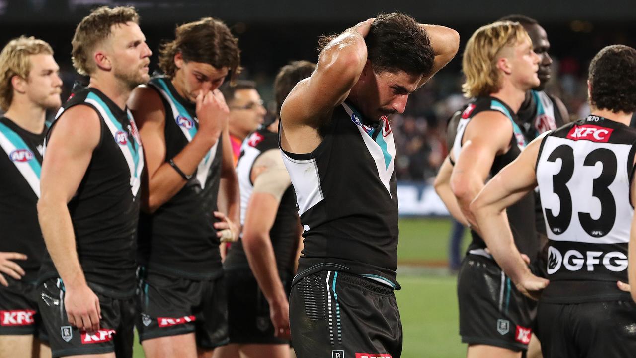 ADELAIDE, AUSTRALIA - SEPTEMBER 16: Lachie Jones of the Power with team mates after the loss during the 2023 AFL Second Semi Final match between the Port Adelaide Power and the GWS GIANTS at Adelaide Oval on September 16, 2023 in Adelaide, Australia. (Photo by Sarah Reed/AFL Photos via Getty Images)