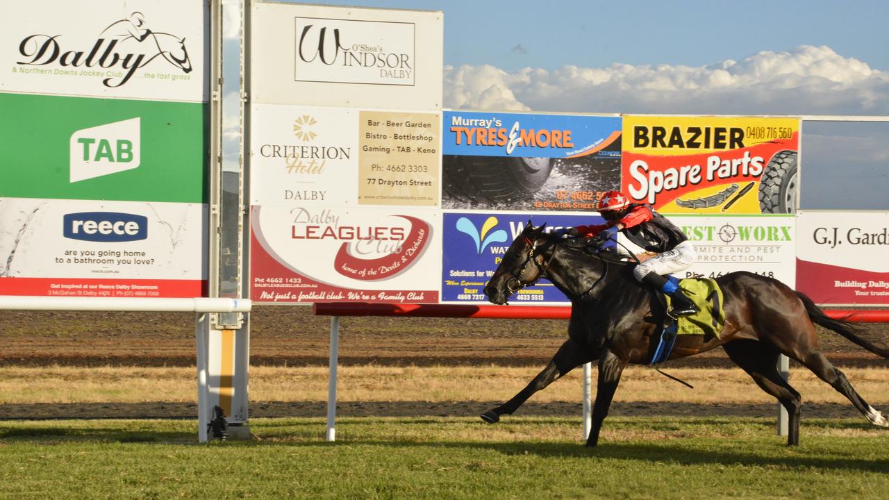 Mishani El Lobo and apprentice Nathan Fazackerley streak to the line to win today's Dalby Newmarket at Bunya Park. Picture: Glen McCullough