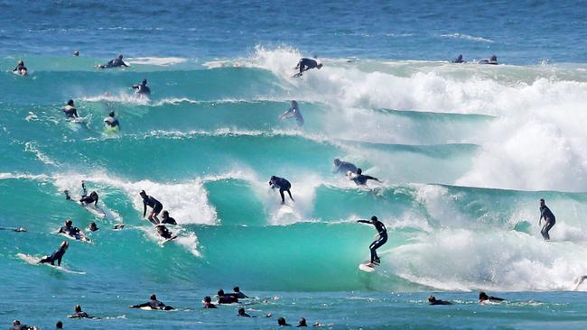 Pumping surf brings out the crowds at Snapper Rocks. Picture: Luke Marsden.