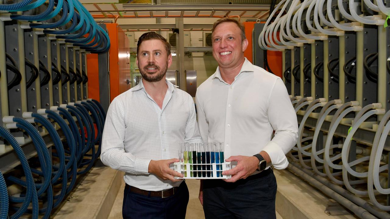 Vecco Group Managing Director Tom Northcott and Premier Steven Miles with samples of vanadium electrolyte at the Vecco Group in Townsville. Picture: Evan Morgan