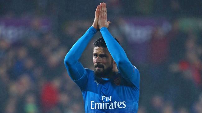 Arsenal's French striker Olivier Giroud applauds supporters.