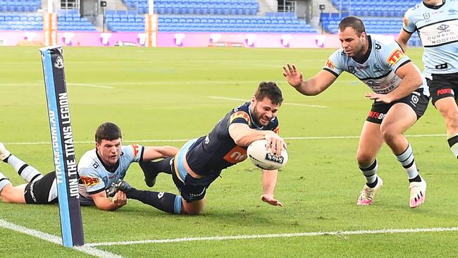 GOLD COAST, AUSTRALIA - JULY 04: Anthony Don of the Titans scores a try during the round eight NRL match between the Gold Coast Titans and the Cronulla Sharks at Cbus Super Stadium on July 04, 2020 in Gold Coast, Australia. (Photo by Ian Hitchcock/Getty Images)