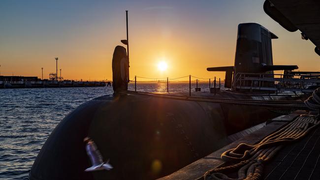 The sun rises over a Royal Australian Navy submarine at HMAS Stirling in Garden Island. Picture: POIS Yuri Ramsey/Australian Defence Force via Getty Images