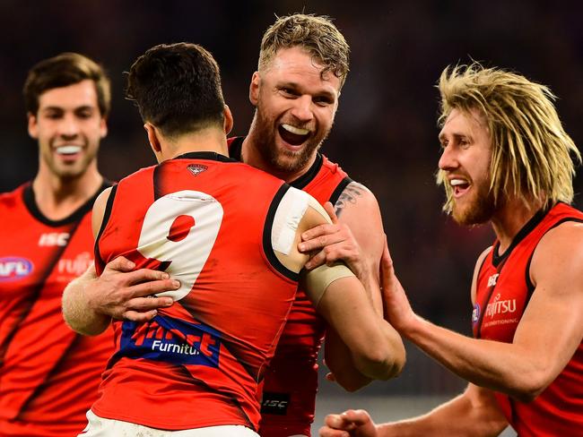 PERTH, AUSTRALIA - AUGUST 17: Jake Stringer and Dylan Shiel of the Bombers celebrates after scoring a goal during the 2019 AFL round 22 match between the Fremantle Dockers and the Essendon Bombers at Optus Stadium on August 17, 2019 in Perth, Australia. (Photo by Daniel Carson/AFL Photos)