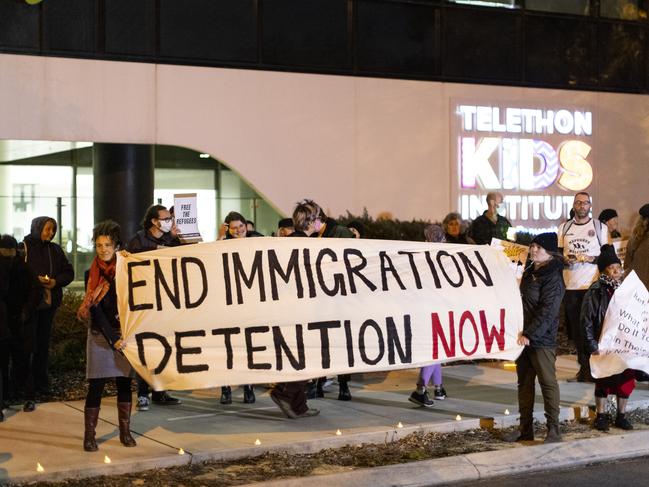 PERTH, AUSTRALIA - JUNE 09:  Members of the public are seen holding signs during a vigil outside the Perth Children's Hospital on June 9, 2021 in Perth, Australia. Three-year-old Tharnicaa, the daughter of the Tamil family from Biloela in Queensland was medically evacuated from detention on Christmas Island to receive medical care in Perth after becoming sick. The family have been detained on Christmas Island since 2019. (Photo by Matt Jelonek/Getty Images)