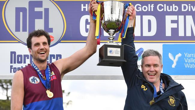 Banyule captain Scott Gumbleton and coach Pete Davey raise the NFL Division 3 premiership cup in 2017. Picture: Andy Brownbill