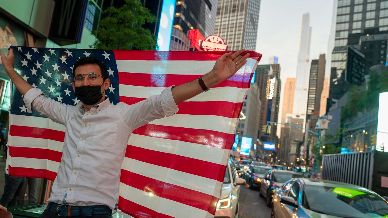 People celebrate Biden’s win in the streets in Times Square. Picture: David Dee Delgado/Getty Images/AFP