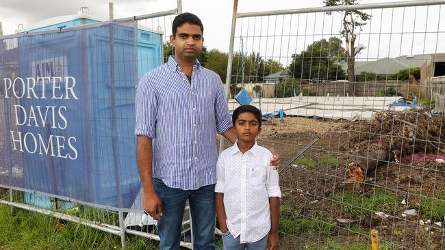 Jesu Jacob with his son Jax at the slab for their house in Keilor East. Picture: Ian Currie