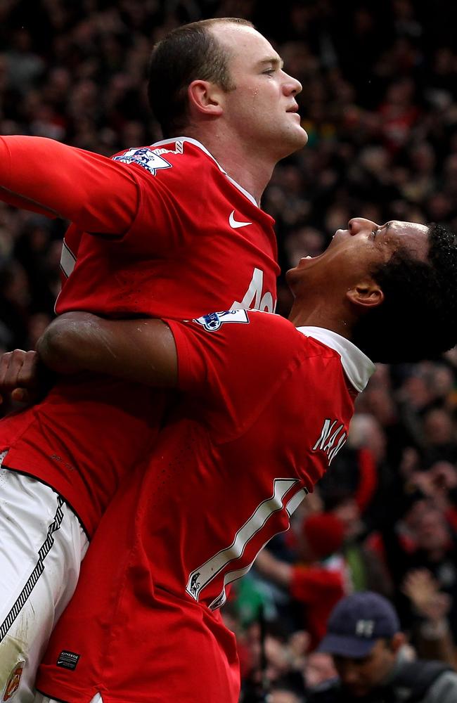 Rooney celebrates with teammate Nani after he scores a goal from an overhead kick during the Barclays Premier League match between Manchester United and Manchester City in 2011.