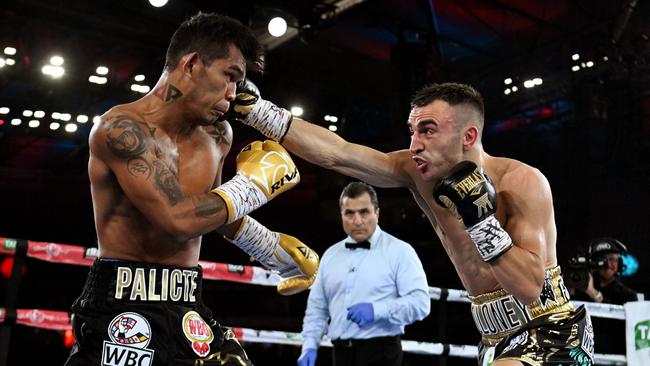 Jason Moloney (R) against Aston Palicte during their World Boxing Council (WBC) silver bantamweight and the vacant World Boxing Organization (WBO) International bantamweight championship title fight (Photo by William WEST / AFP)