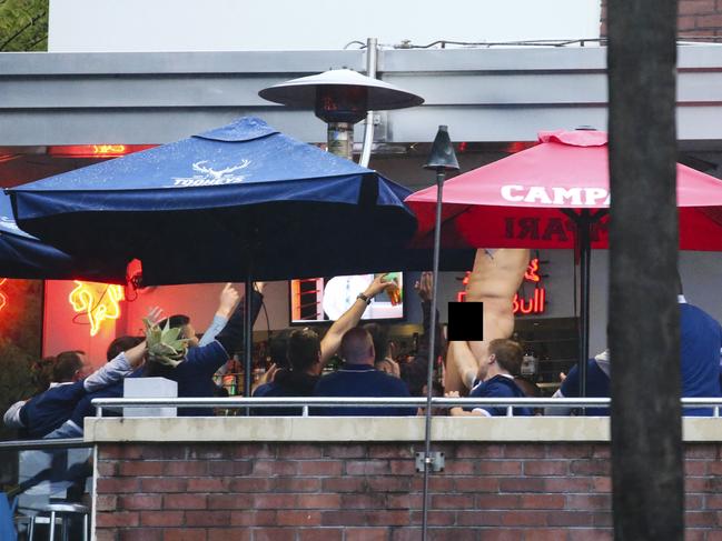 Canterbury Bulldogs players strip off during Mad Monday celebrations. Picture: Justin Lloyd.