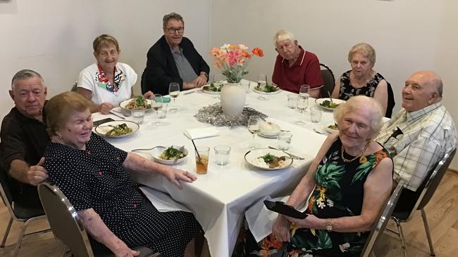 Cairns couple Graham and Rewa Real (front) have celebrated their 60th wedding anniversary alongside friends Anna and Don O'Neill, Best Man Bill Mellor and wife Eileen Mellor, and Matron of Honour Jan Lidstone and husband Jim Lidstone. Photo: Supplied.