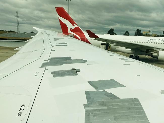 The true reason passengers spotted a large volume of tape on a Qantas plane’s wing has been revealed – and the explanation is far less suspicious than first thought.