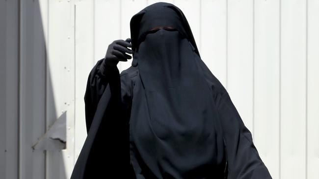 A woman at the house of Hassan Khalif Shire Ali in Meadow Heights. Picture: David Geraghty