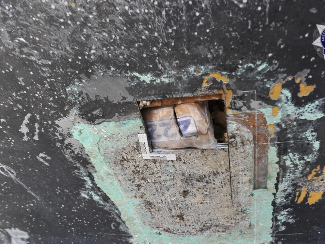 The AFP has charged two men with importing a commercial quantity of cocaine as part of an investigation into 247kg of cocaine seized from a yacht moored in Townsville.
