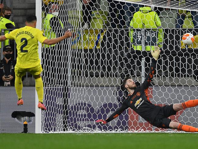 Villarreal's Spanish defender Mario Gaspar scores past David de Gea during the UEFA Europa League final. (Photo by Adam Warzawa / various sources / AFP)