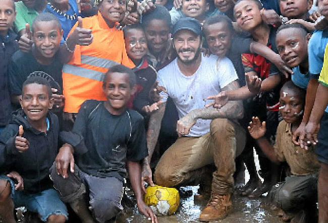 David Beckham with local children in Kumnga Village in the Western Highlands Province of Papua New Guinea. Picture: PHOTO Jackie Nickerson