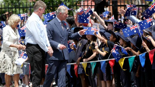 Mike Tate with King Charles III and his wife Camilla greeting children at Kilkenny Primary School in 2012.