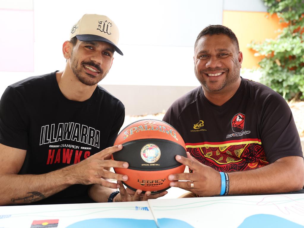 Illawarra Hawks Indigenous star Will ‘Davo’ Hickey with Indigenous artist Luke Penrith during at the National Centre of Indigenous Excellence. Picture: Getty Images