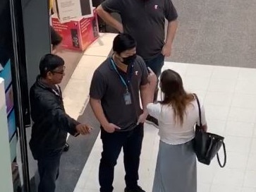 Stills from a video showing a woman making a shocking racist attack on employees at Telstra Miranda as coronavirus grips the nation. Picture: Supplied (STRICTLY exclusive to NewsLocal, please contact Jess Clement before additional use.)