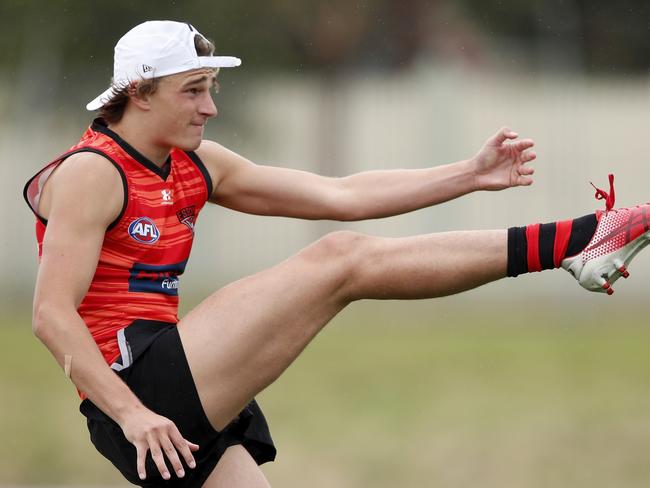 MELBOURNE, AUSTRALIA - DECEMBER 07: Harrison Jones of the Bombers kicks the ball during the Essendon Bombers training session at The Hangar on December 07, 2020 in Melbourne, Australia. (Photo by Dylan Burns/AFL Photos via Getty Images)