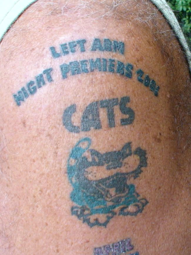 Tattoos you get when drunk. Cats fan 'Neville' shows off the handiwork of a Thai tattoo artist, who labelled the Cats 'Gay premiers'. Geelong.