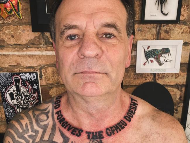 Former CFMEU boss John Setka shows off new ink with a tattoo reading, God Forgives The CFMEU Doesn’t, on his neck. Supplied