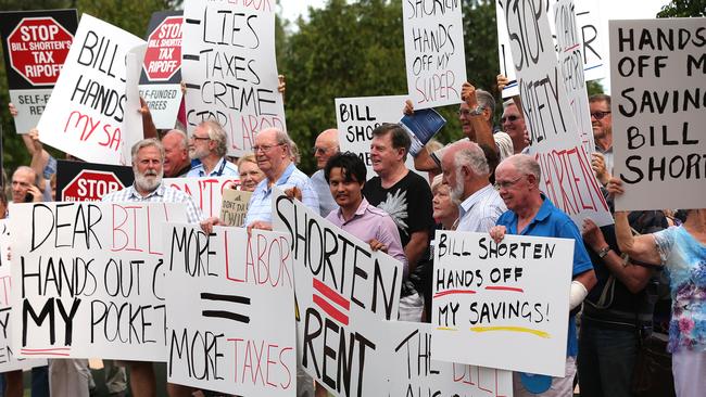 Members of the public protest changes to franking credits rules outside after a Senate Committee hearing at Upper Coomera on the Gold Coast. Picture: Lyndon Mechielsen