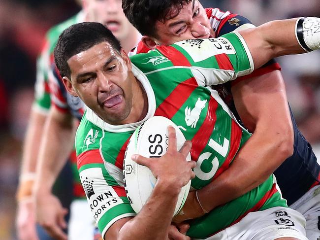 BRISBANE, AUSTRALIA - AUGUST 27:  Cody Walker of the Rabbitohs is tackled during the round 24 NRL match between the Sydney Roosters and the South Sydney Rabbitohs at Suncorp Stadium on August 27, 2021, in Brisbane, Australia. (Photo by Chris Hyde/Getty Images)