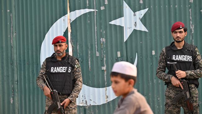 Paramilitary soldiers stand guard outside the Government Health and Educational complex after Indian strikes in Muridke, about 30 kilometres from Lahore, on May 7, 2025. The death toll from Indian strikes on Pakistan has increased to eight, the country's military spokesman said on May 7, as India fired missiles at Pakistani territory and Islamabad vowed to 