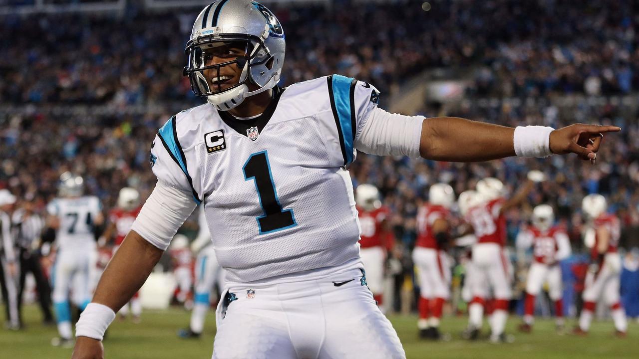 (FILES) In this file photo taken on January 23, 2016 Cam Newton #1 of the Carolina Panthers celebrates after Ted Ginn Jr. #19 scores a touchdown in the first quarter against the Arizona Cardinals during the NFC Championship Game at Bank of America Stadium in Charlotte, North Carolina. - Quarterback Cam Newton, the former NFL Most Valuable Player who guided Carolina to the 2016 Super Bowl, has reached a deal to return to the Panthers, the club announced November 11, 2021. (Photo by STREETER LECKA / GETTY IMAGES NORTH AMERICA / AFP)